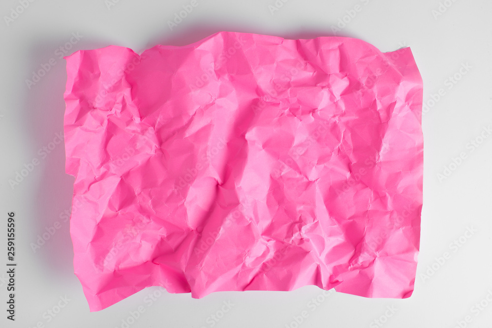 Composition of crumpled sheet of paper placed on a white background Composition of crumpled sheet of paper placed on a white background