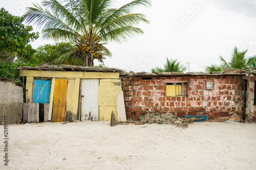 Poorly built shacks by the beach on Itamaraca Island (Pernambuco, Brazil) © Helissa