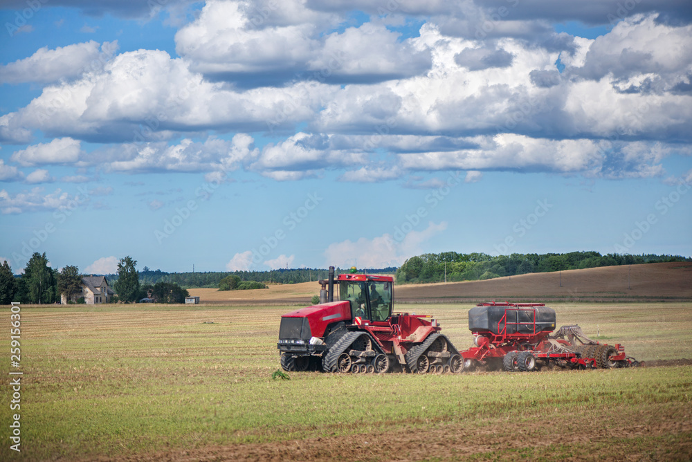 Agricultural background with red tractor pulling plow, throwing dust in air. Combine harvester at wheat field. Heavy machinery during cultivation, working on fields. Dramatic sky, rain, storm clouds
Agricultural background with red tractor pulling plow, throwing dust in air. Combine harvester at wheat field. Heavy machinery during cultivation, working on fields. Dramatic sky, rain, storm clouds