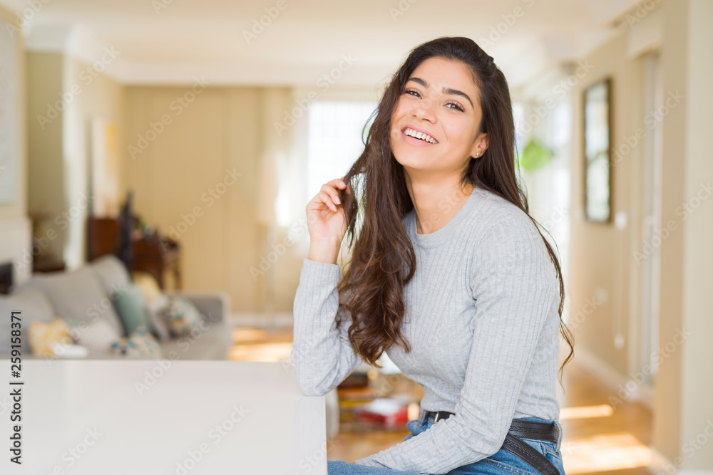 Beautiful brunette woman smiling cheerful with big smile, looking positive and happy Beautiful brunette woman smiling cheerful with big smile, looking positive and happy