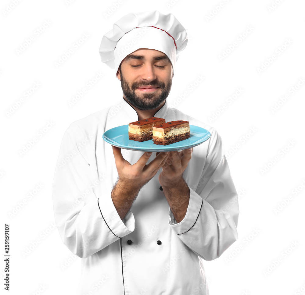 Male confectioner with tasty dessert on white background Male confectioner with tasty dessert on white background