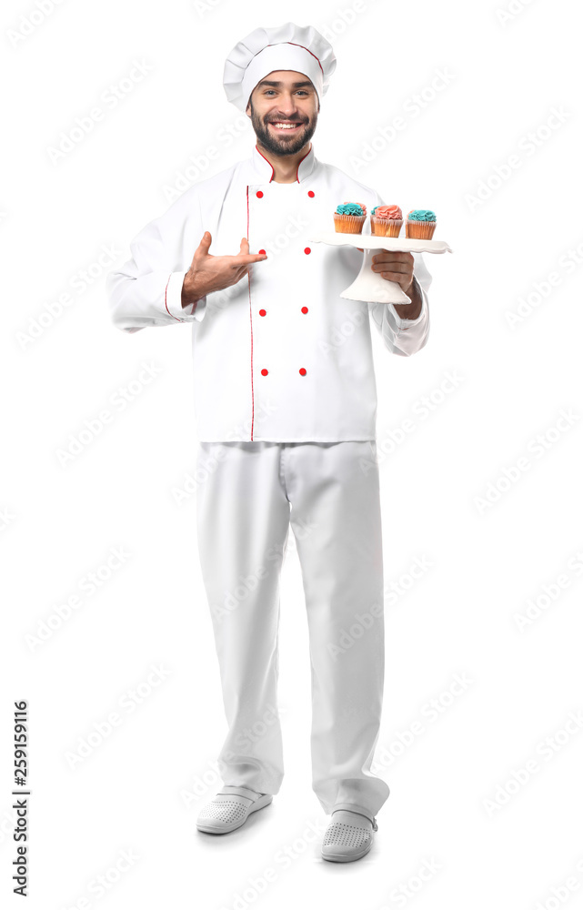 Male confectioner with tasty dessert on white background Male confectioner with tasty dessert on white background
