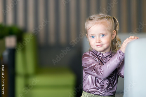 Girl 4-5 years old with white hair in braids with blue eyes