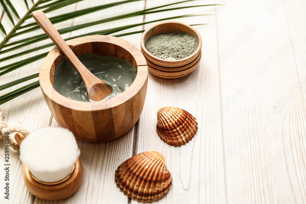 Cosmetic clay on white wooden table