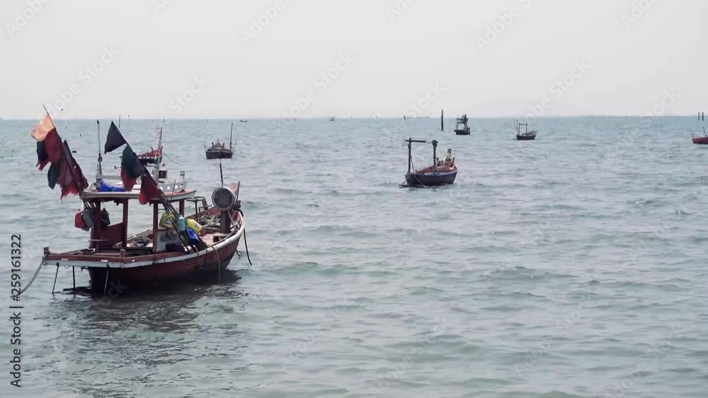 Fishing boats float in the sea after catching fish Fishing boats float in the sea after catching fish