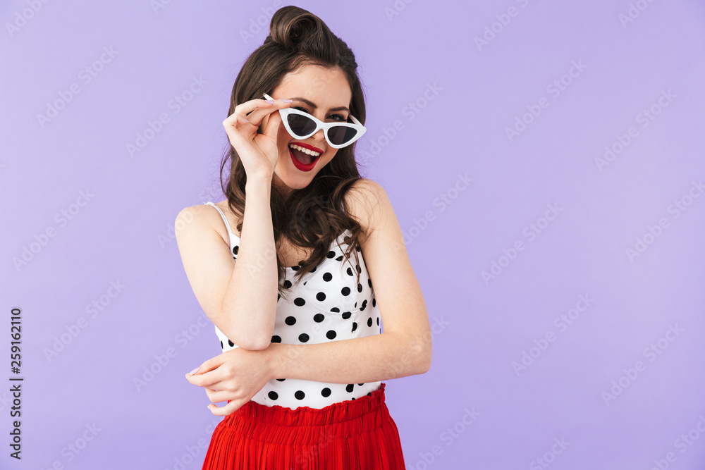 Portrait of a beautiful pin-up girl wearing bright makeup