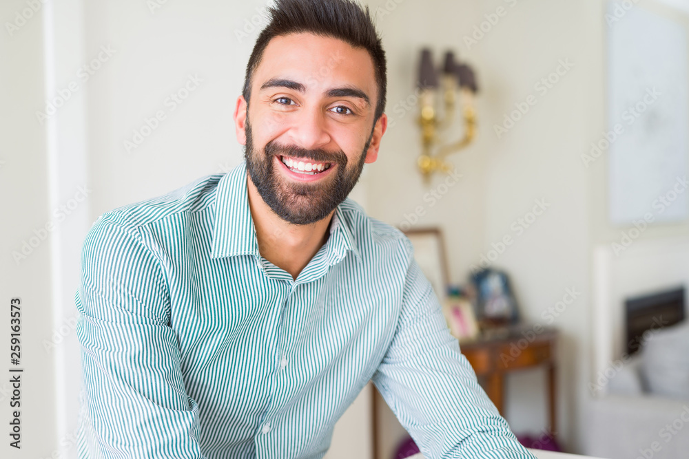 © Krakenimages.com - Handsome man smiling cheerful with a big smile on face showing teeth, positive and happy expression