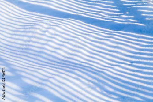 Striped shadow pattern on snow