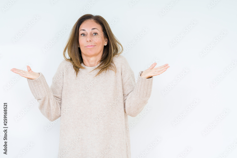 Beautiful middle age woman over isolated background clueless and confused expression with arms and hands raised. Doubt concept. Beautiful middle age woman over isolated background clueless and confused expression with arms and hands raised. Doubt concept.