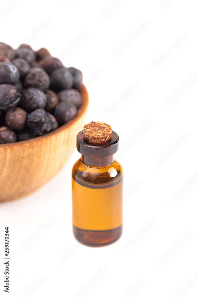 Juniper Berry Essential Oil Isolated on a White Background Juniper Berry Essential Oil Isolated on a White Background