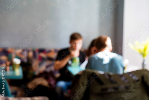 Blurred background of people eating and talking in restaurant