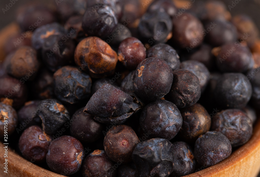 Bowl Full of Dried Juniper Berries on a Wooden Table Bowl Full of Dried Juniper Berries on a Wooden Table