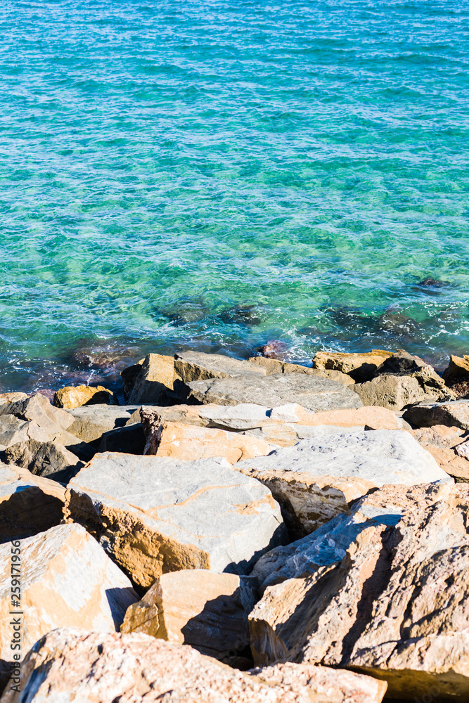 Amazing beautiful blue ocean and rocks on a sunny day, natural outdoor landscape by the beach Amazing beautiful blue ocean and rocks on a sunny day, natural outdoor landscape by the beach