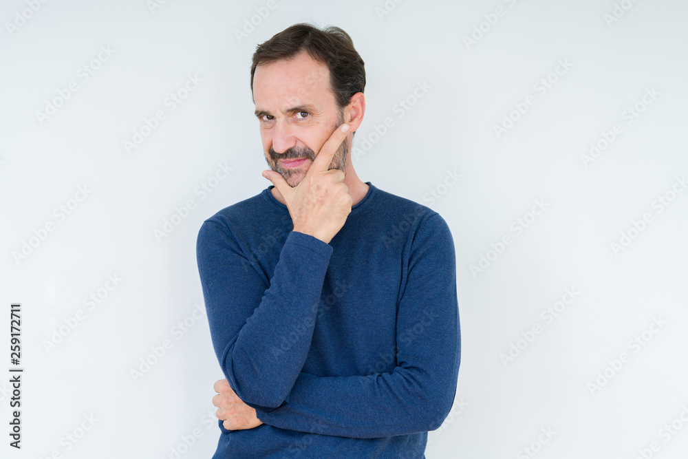 Elegant senior man over isolated background looking confident at the camera with smile with crossed arms and hand raised on chin. Thinking positive. Elegant senior man over isolated background looking confident at the camera with smile with crossed arms and hand raised on chin. Thinking positive.