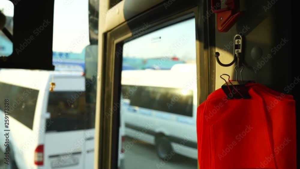 Looking out the window of intercity bus departing from bus station ...