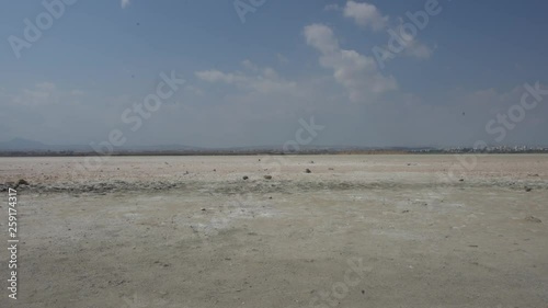 Panorama footage of salt lake with mirrage of distant  photo