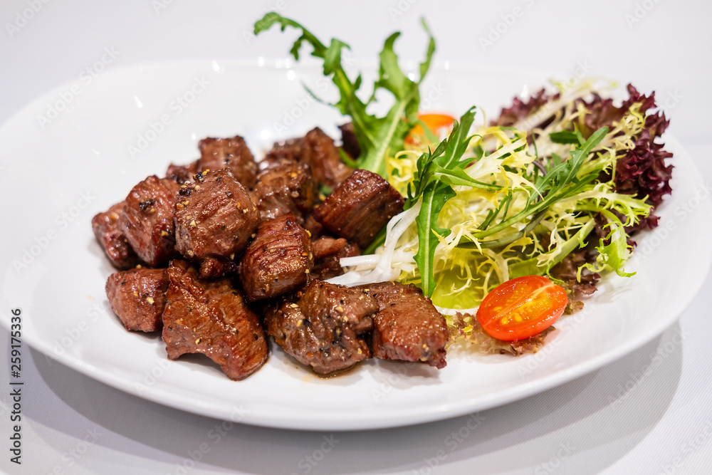 Fried sauteed beef tenderlion cubes with black pepper Fried sauteed beef tenderlion cubes with black pepper
