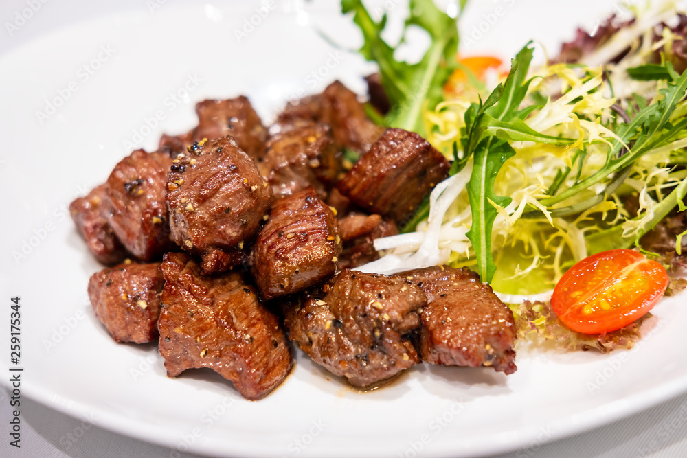 Fried sauteed beef tenderlion cubes with black pepper