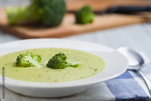 Broccoli soup in white bowl