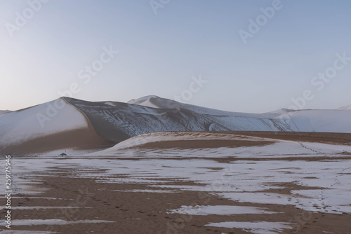 Dunhuang ,  China :  The Silk road - Mingsha sand mountain (Gobi desert) with snow covered in the early winter