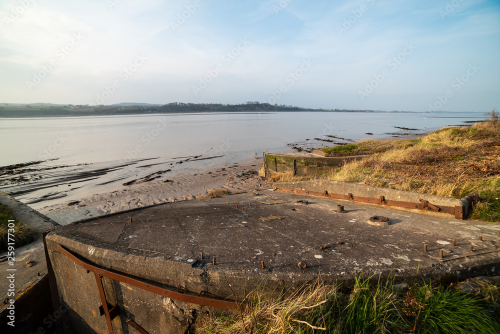 Historic tidal river bank erosion protection scheme at Purton Hulks, Gloucestershire, UK Historic tidal river bank erosion protection scheme at Purton Hulks, Gloucestershire, UK