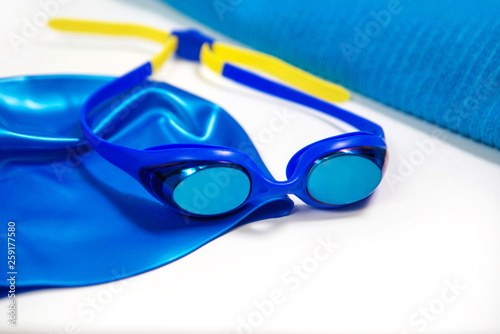 swimming glasses, swimming cap, towel