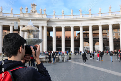 young photographer in Saint Peter Square in Vatican City