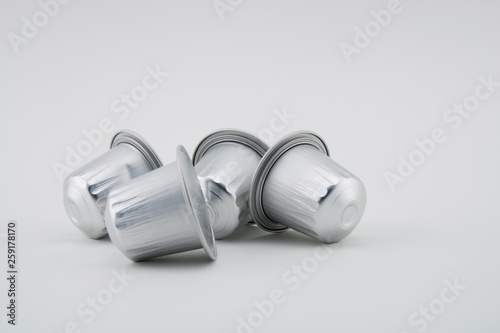 Espresso coffee capsules or coffee pods on white background. Coffee machine.