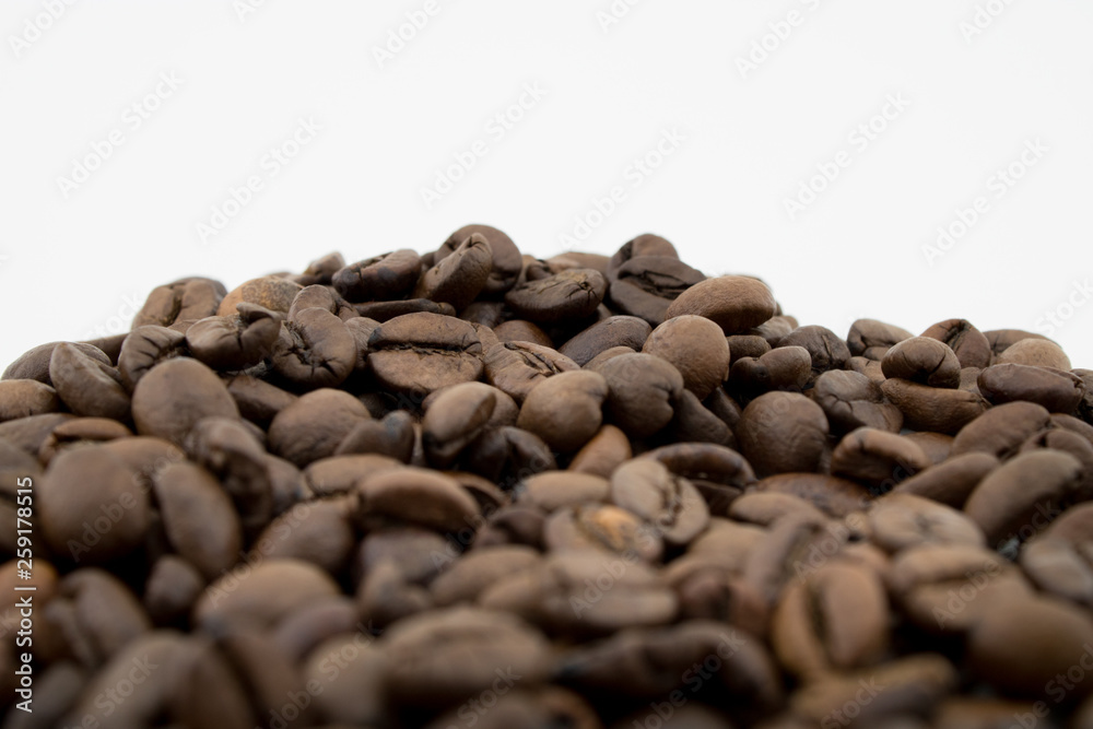 Roasted coffee beans on white background. Roasted coffee beans on white background.