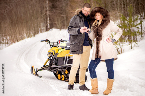 The couple rode a snowmobil...