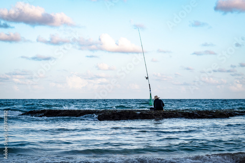 Fishing alone at sunset