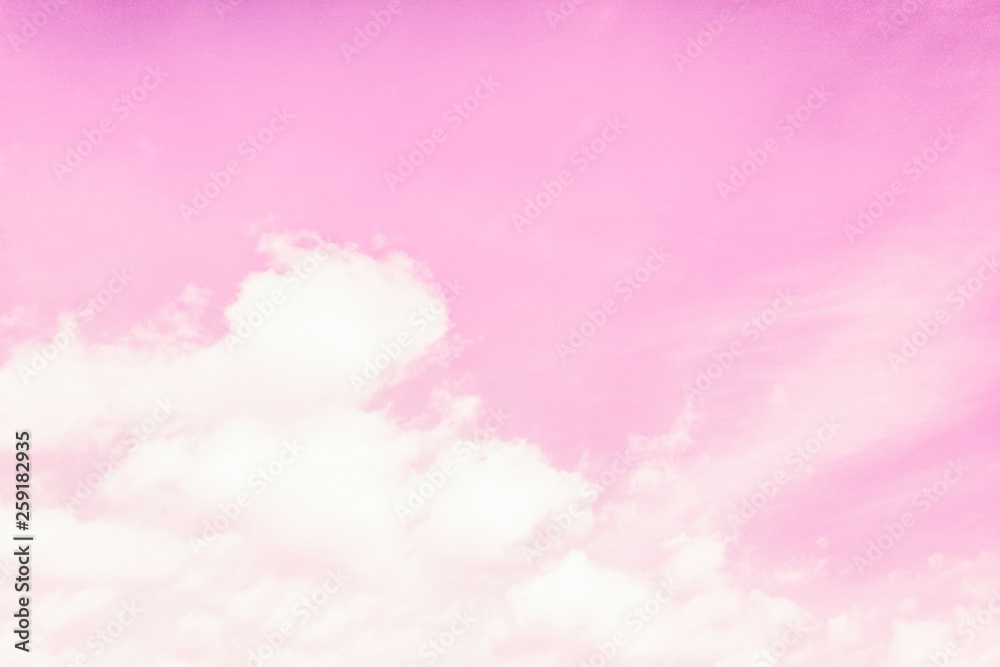 Beautiful fluffy clouds on a light pink sky background