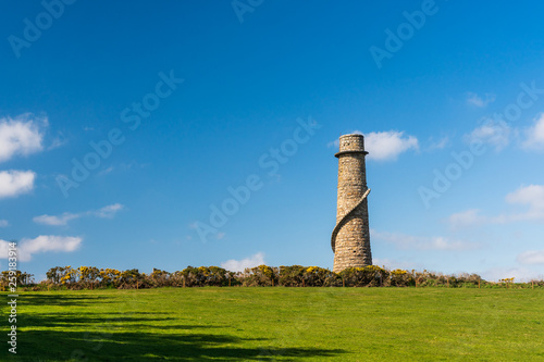 Canvas Print Abandoned lead mine flue chimney under a sunny blue sky