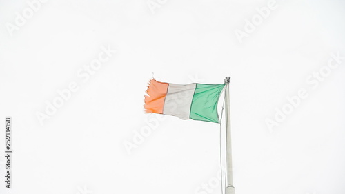 12452_The_flag_of_Ireland_waving_on_the_tall_pole_in_Ireland.jpg