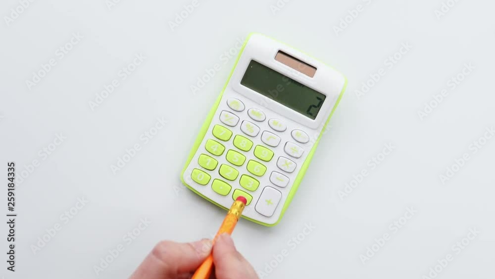 Counting finances and amount on calculator using pencil Counting finances and amount on calculator using pencil