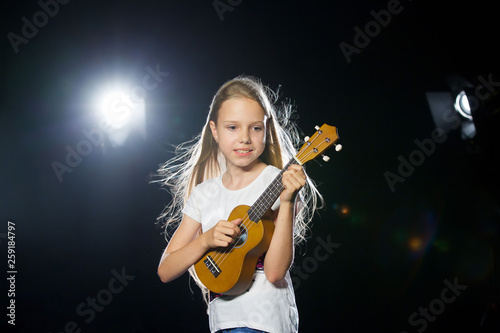 Charming positive curly girl musician