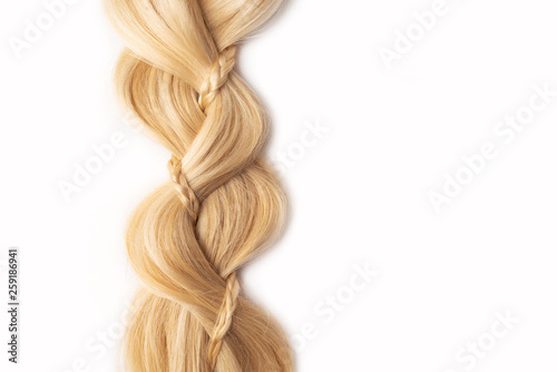 Light blond hair tress on white isolated background. Human, natural hairstyle with copy and free space. Floating border. Fashionable hairstyle for a poster, an advertisement or a hairdressing website.