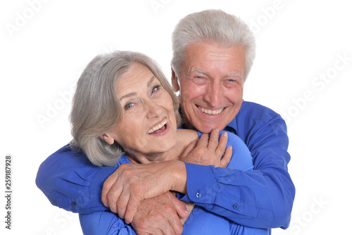 Portrait of happy senior couple posing on white background
