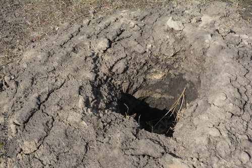 Digging hole for fence  concrete foundation holder. photo