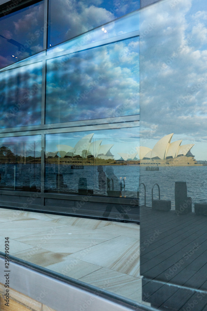reflection of the opera house in the window