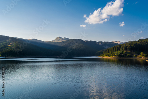 Bolboci lake in Bucegi National Park surrounded by the Carpathian Mountains in Romania, East Europe. Popular tourist destination, travel attraction.