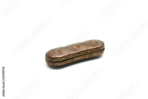 Closed spectacle case with brown circles design isolated on white background. Fashion accessory for glasses.