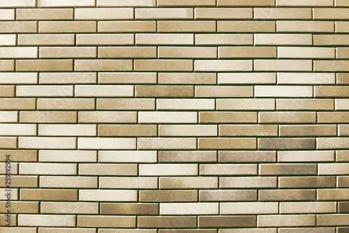 Old beige and white brick wall background texture