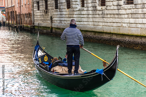 Traditional canal street with gondolier in Venice, Italy © Stefanos Kyriazis