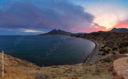 Coastline of La Isleta del Moro at sunset in Cabo de Gata-Nijar Natural Park, Spain photo