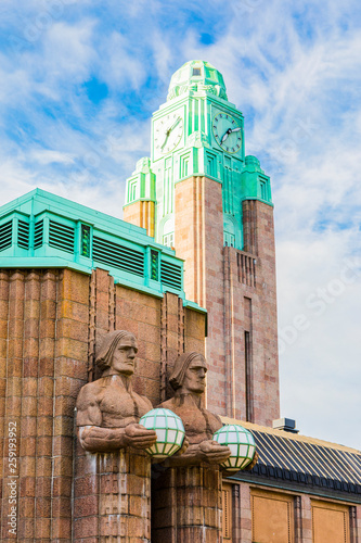 Emil Wikstrom's statues on Helsinki Central Station in Helsinki, Finland photo