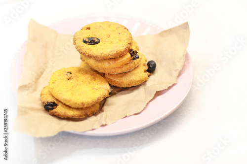 Cookies with raisins on a plate.
