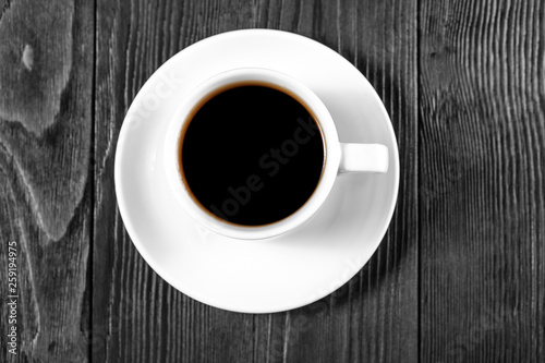 Cup of coffee with brown sugar on a wooden table
