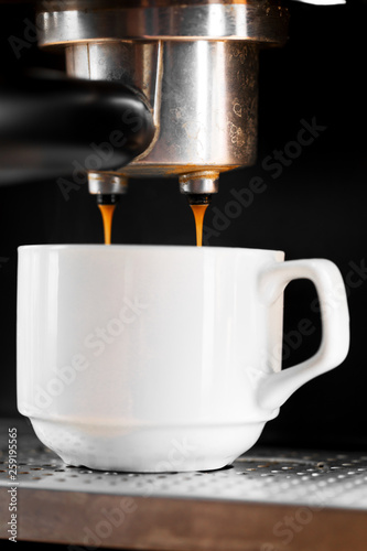 Close-up of espresso pouring from coffee machine