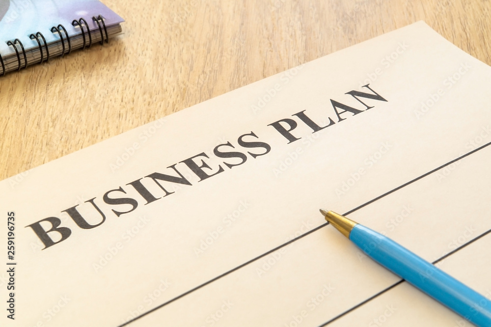 Strategy business plan with pen and notepad on table. Strategy business plan with pen and notepad on table.